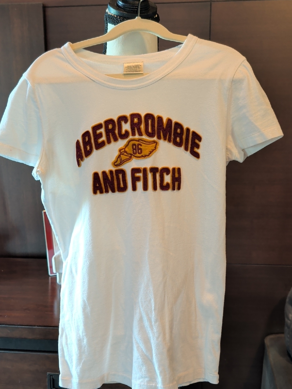 Abercrombie & Fitch White Tee with Burgundy and Gold Appliqué